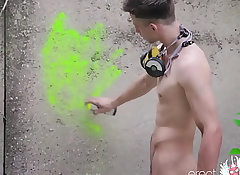 In one's birthday suit teen boy with puristic to enduring dick draws bright graffiti outdoor